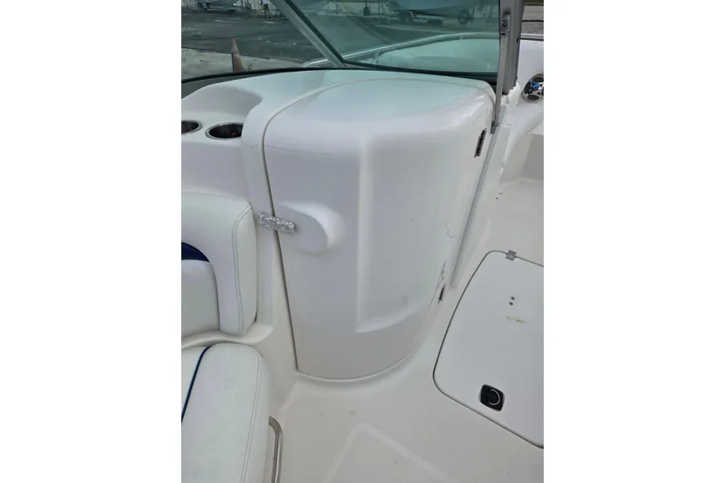 Slide: The Image of 2012 Hurricane SunDeck 2000 OB boat interior with seating and storage compartment. - 11