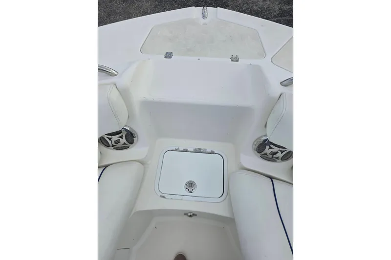 Slide: The Image of 2012 Hurricane SunDeck 2000 OB boat interior with seating and storage compartment. - 16