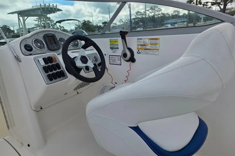 Slide: The Image of 2012 Hurricane SunDeck 2000 OB boat cockpit with steering wheel and control panel. - 20