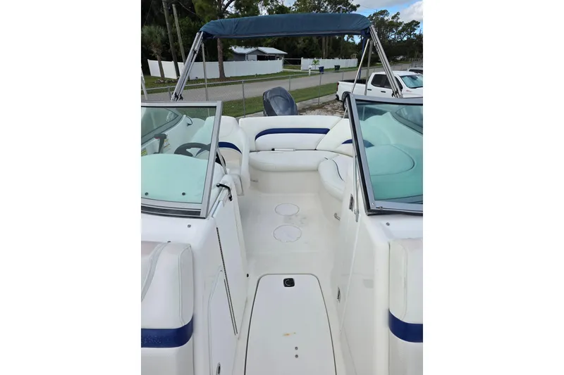 Slide: The Image of 2012 Hurricane SunDeck 2000 OB boat interior with seating and windshield. - 21