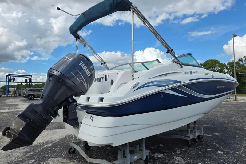 Slide: The Image of 2012 Hurricane SunDeck 2000 OB boat with Yamaha outboard motor on display. - 4