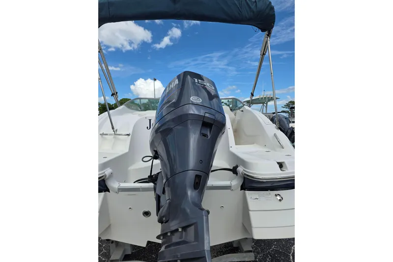 Slide: The Image of 2012 Hurricane SunDeck 2000 OB boat with Yamaha outboard motor under blue sky. - 5