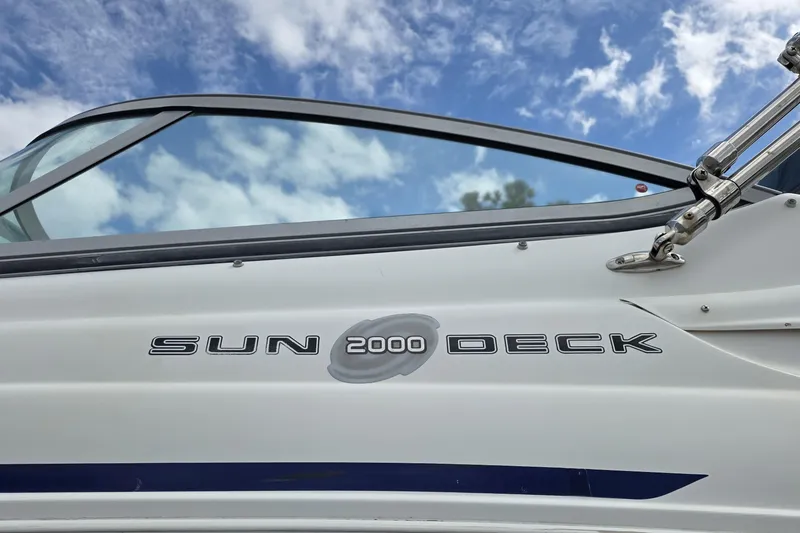 Slide: The Image of 2012 Hurricane SunDeck 2000 OB boat with clear sky background. - 7