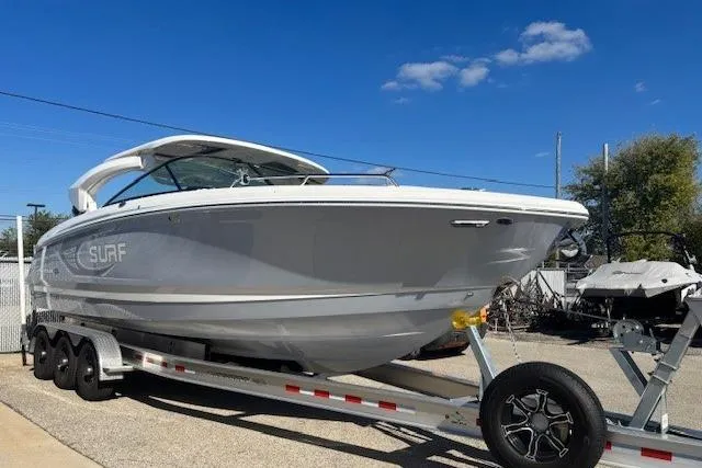 Slide: The Image of Dashboard of 2024 Chaparral 30 Surf with Simrad navigation displays. - 10