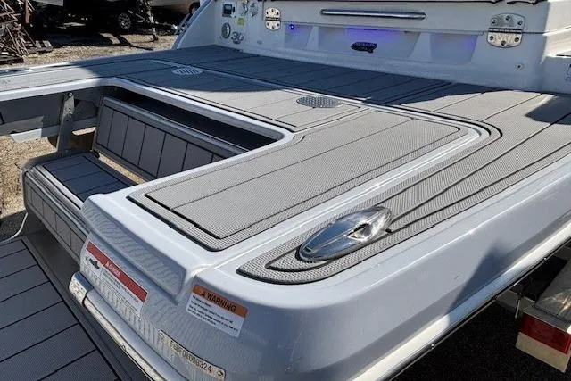 Slide: The Image of 2024 Chaparral 30 Surf boat on a trailer, showcasing sleek design and branding. - 18