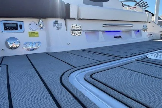 Slide: The Image of 2024 Chaparral 30 Surf boat with MerCruiser engine and stainless steel propeller. - 24