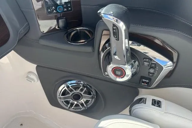 Slide: The Image of 2024 Chaparral 30 Surf boat cockpit with modern steering and controls. - 28