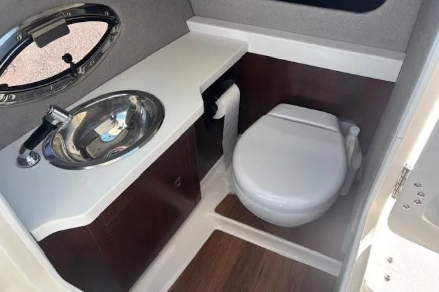 Slide: The Image of Control panel of 2024 Chaparral 30 Surf boat with throttle and speaker. - 29