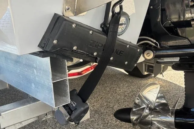 Slide: The Image of 2024 Chaparral 30 Surf boat's outdrive and propeller on a trailer. - 40