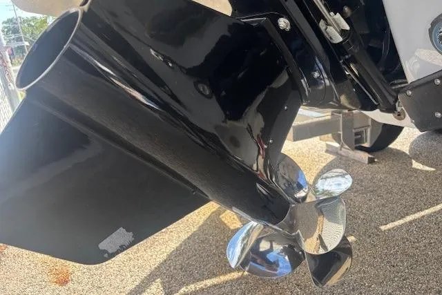 Slide: The Image of 2024 Chaparral 30 Surf boat on trailer under clear blue sky. - 43