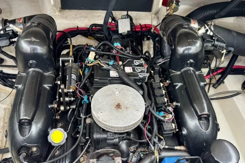 Slide: The Image of Engine compartment of a 2012 Sea Ray 250 SLX boat, showcasing detailed components. - 15