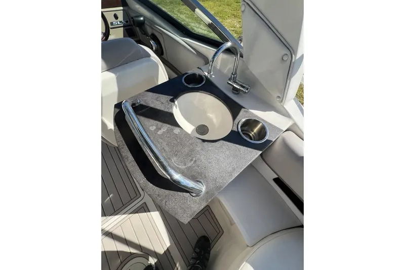 Slide: The Image of 2012 Sea Ray 250 SLX boat interior with sink and countertop. - 6