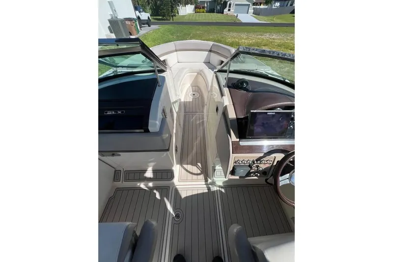 Slide: The Image of 2012 Sea Ray 250 SLX boat interior with sleek dashboard and modern controls. - 8