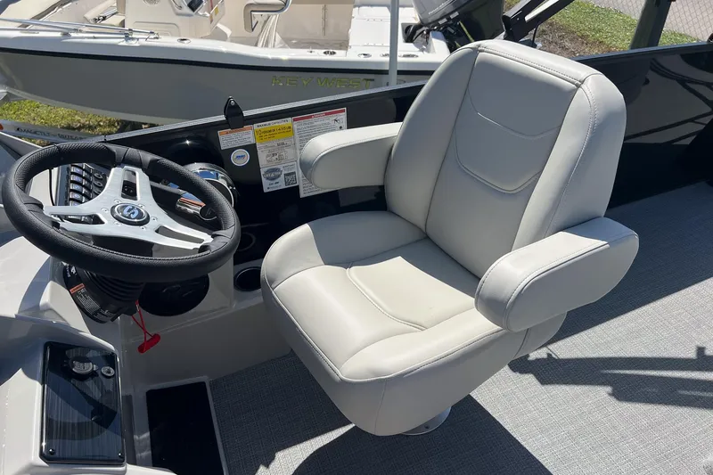Slide: The Image of Captain's chair and steering wheel of 2026 Sylvan MIRAGE 822 CLZ DH boat. - 15