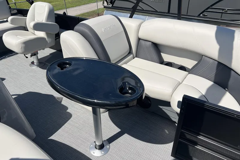 Slide: The Image of 2026 Sylvan MIRAGE 822 CLZ DH boat interior with seating and table. - 7