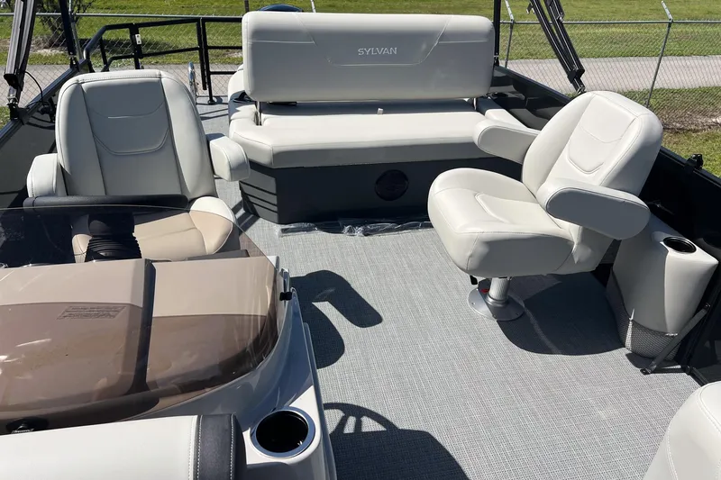 Slide: The Image of 2026 Sylvan MIRAGE 822 CLZ DH boat interior with plush seating and modern design. - 9