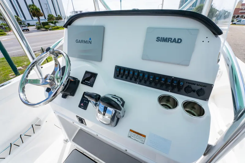 Slide: The Image of 2019 Twin Vee 240 GFX CC boat console with Garmin and Simrad electronics. - 19