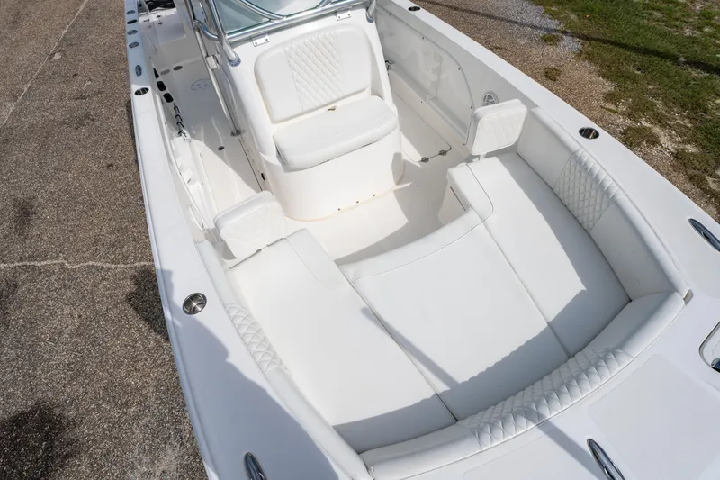 Slide: The Image of 2019 Twin Vee 240 GFX CC boat interior with white seating and sleek design. - 20