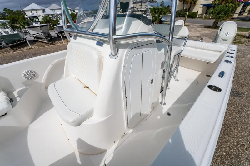 Slide: The Image of 2019 Twin Vee 240 GFX CC boat interior with seating and storage compartments. - 24