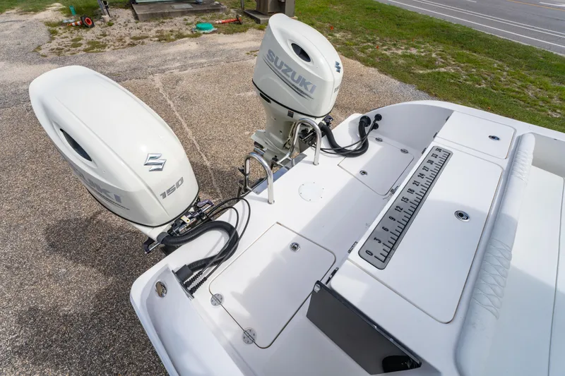 Slide: The Image of Twin Vee 240 GFX CC 2019 boat with dual Suzuki 150 outboard motors. - 28