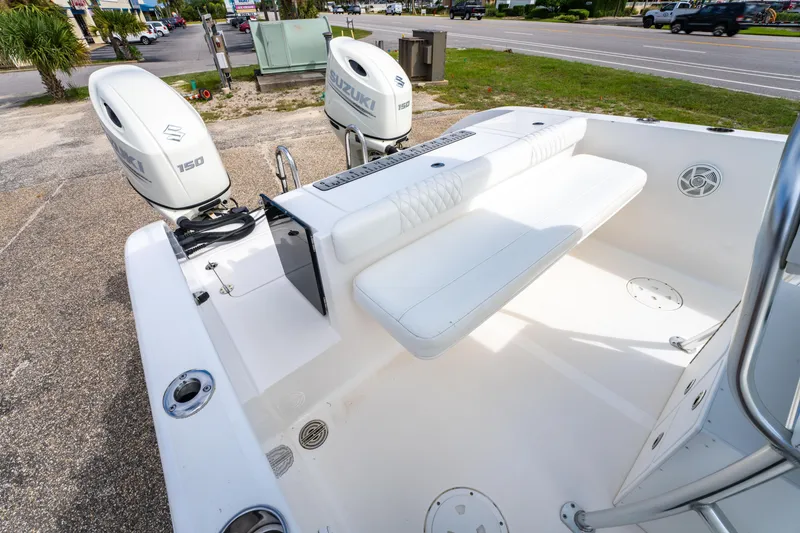 Slide: The Image of 2019 Twin Vee 240 GFX CC boat with dual Suzuki 150 engines, parked on roadside. - 29