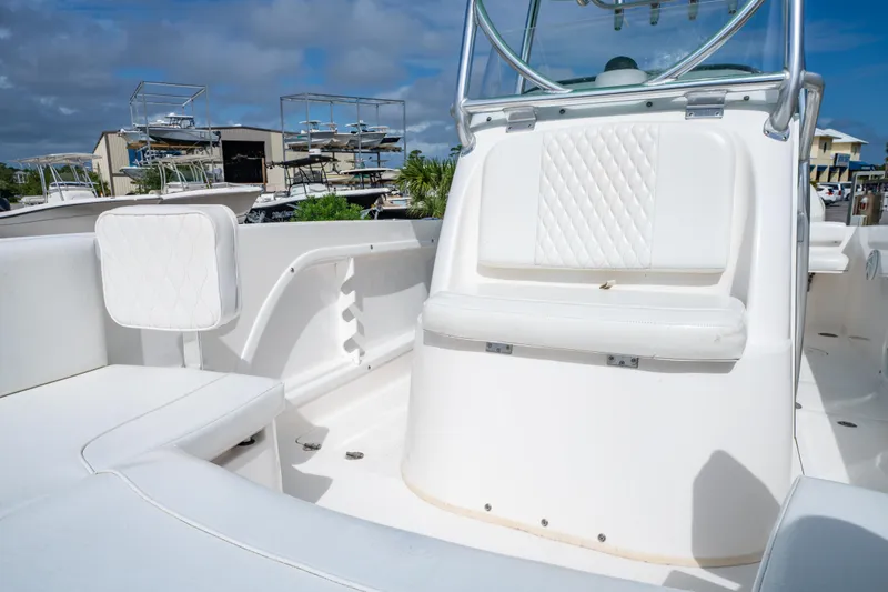 Slide: The Image of 2019 Twin Vee 240 GFX CC boat interior with white seating and console. - 32