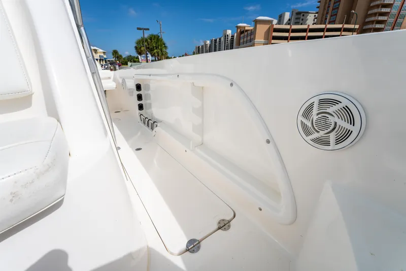 Slide: The Image of 2019 Twin Vee 240 GFX CC boat interior with speaker and storage compartment. - 34