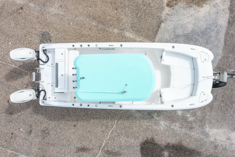 Slide: The Image of Overhead view of 2019 Twin Vee 240 GFX CC boat with dual engines on concrete. - 6