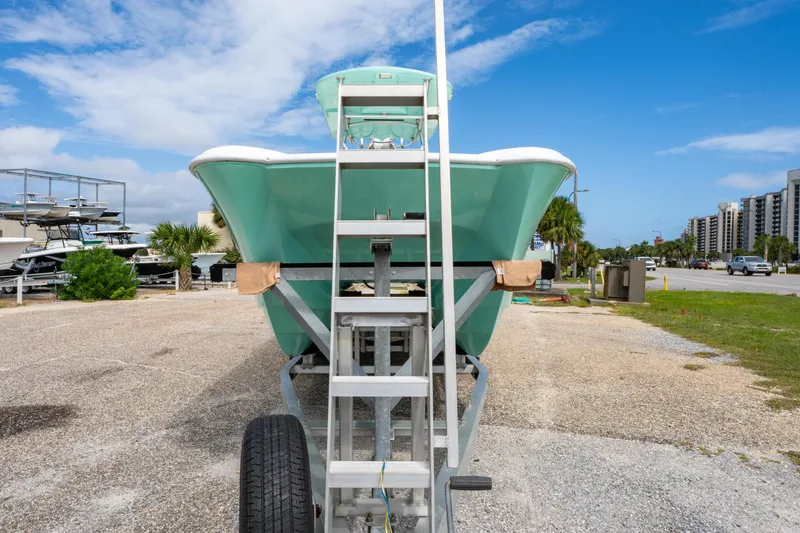 Slide: The Image of 2019 Twin Vee 240 GFX CC boat on trailer, parked outdoors under blue sky. - 9