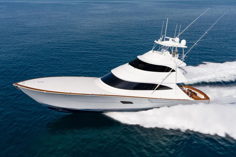 The Image of 2025 Viking 90 Convertible yacht cruising on open sea, showcasing sleek design and performance. - 0