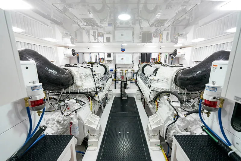Slide: The Image of Engine room of 2025 Viking 90 Convertible yacht, featuring dual engines and advanced systems. - 4
