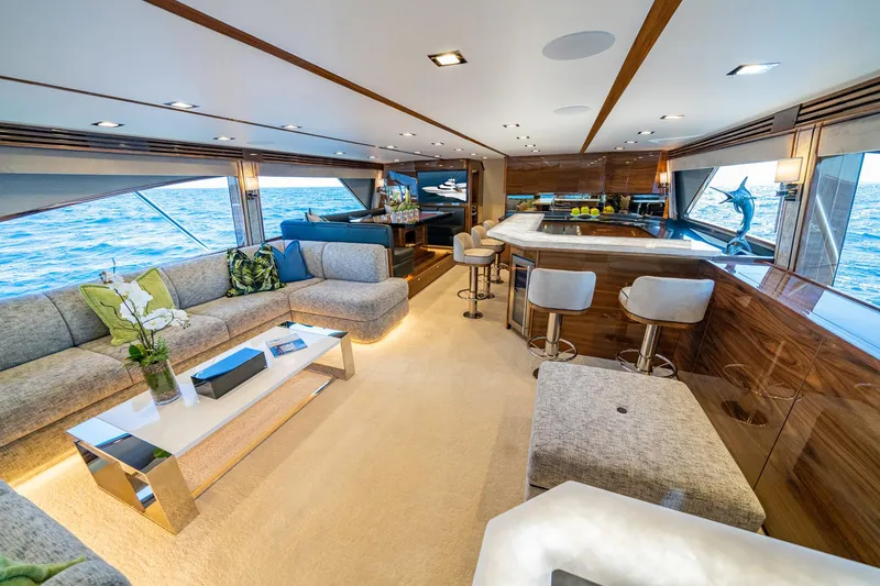 Slide: The Image of Luxurious interior of 2025 Viking 90 Convertible yacht with elegant seating and ocean views. - 8