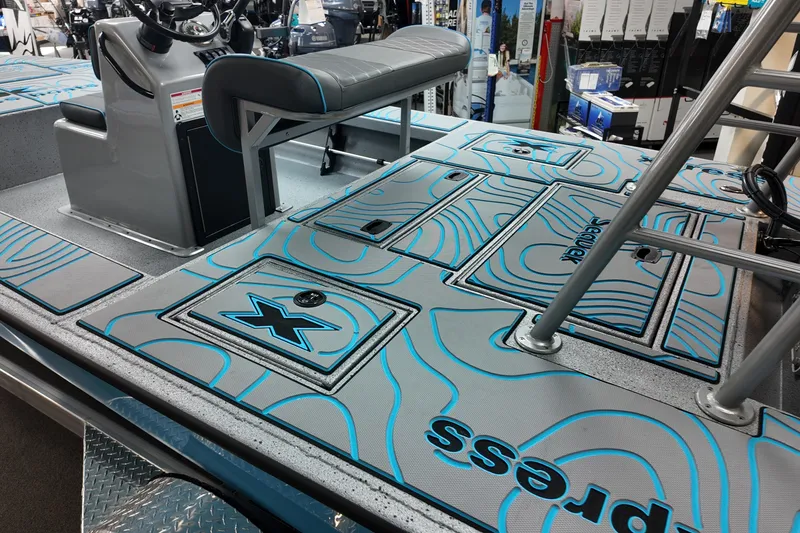 Slide: The Image of 2026 Xpress Skiff 185 boat interior with custom deck design and seating. - 16