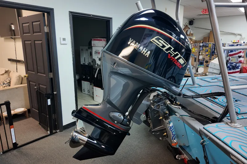 Slide: The Image of 2026 Xpress Skiff 185 with Yamaha SHO VMAX outboard motor in showroom. - 21