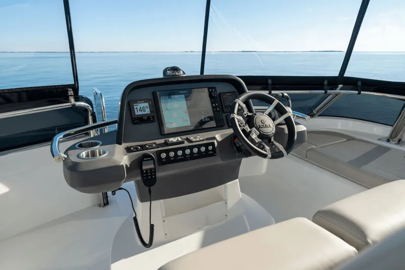 Slide: The Image of The image shows the helm of a 2027 Aquila A42Y with a modern navigation system. - 34
