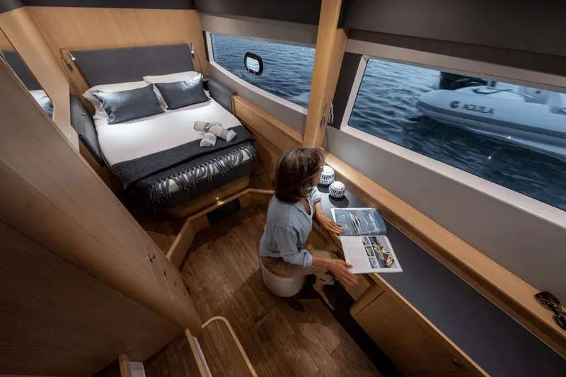 Slide: The Image of Interior of the Aquila A42Y with bed and window view. - 17