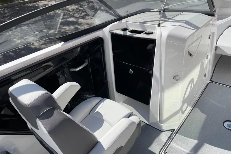 Slide: The Image of 2025 Yamaha Boats AR250 interior with sleek seating and modern console design. - 10