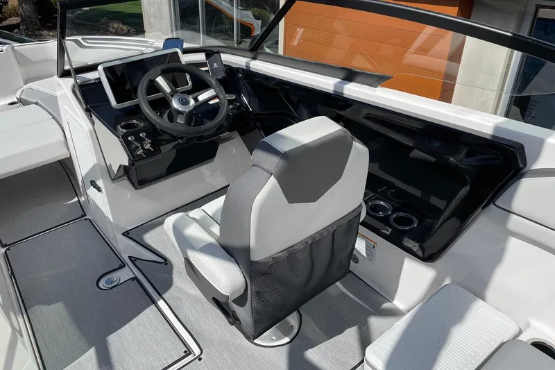 Slide: The Image of 2025 Yamaha Boats AR250 cockpit with modern steering and seating. - 6