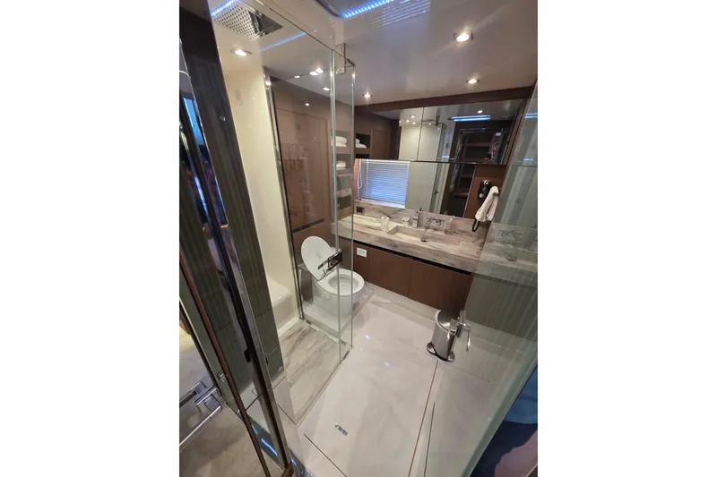 Slide: The Image of Luxurious bathroom in 2022 Prestige X70 yacht with modern fixtures and glass shower. - 11