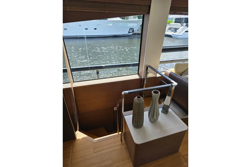 Slide: The Image of Interior of 2022 Prestige X70 yacht with elegant decor and waterfront view. - 12