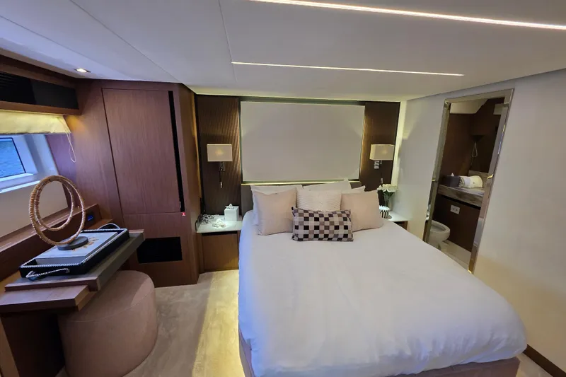 Slide: The Image of Luxurious bedroom interior of 2022 Prestige X70 yacht with modern decor and ensuite bathroom. - 13