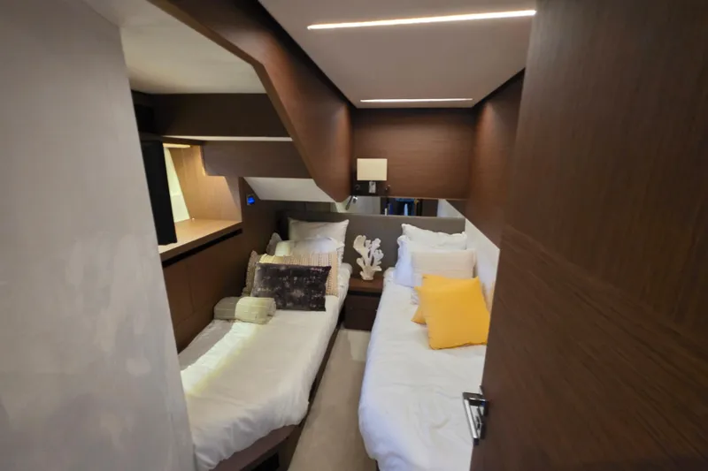 Slide: The Image of Luxurious cabin interior of 2022 Prestige X70 yacht with twin beds and modern decor. - 18