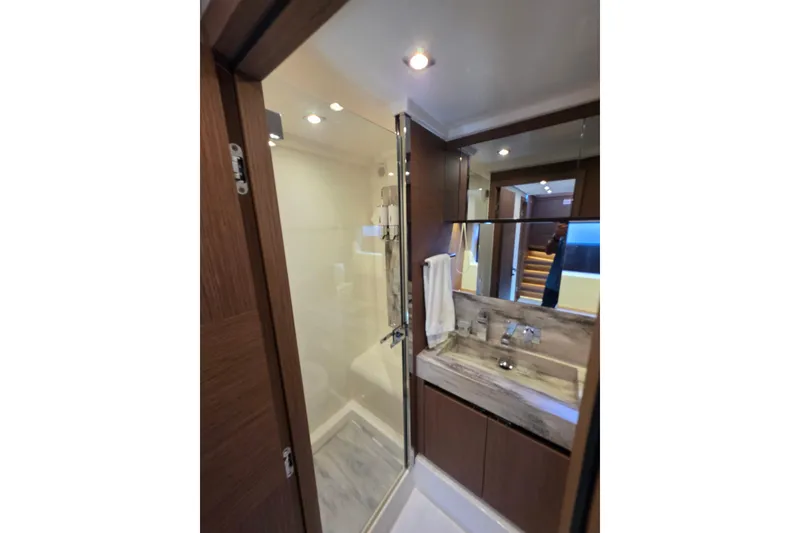 Slide: The Image of Luxurious bathroom in 2022 Prestige X70 yacht with modern fixtures and elegant design. - 20