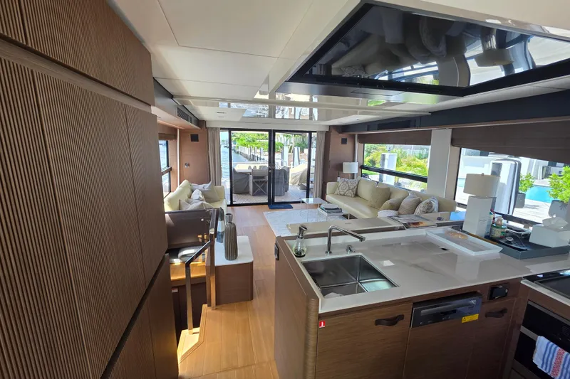 Slide: The Image of Luxurious interior of 2022 Prestige X70 yacht with modern kitchen and spacious seating area. - 4