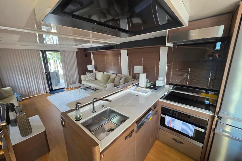 Slide: The Image of Luxurious interior of 2022 Prestige X70 yacht with modern kitchen and cozy living area. - 5