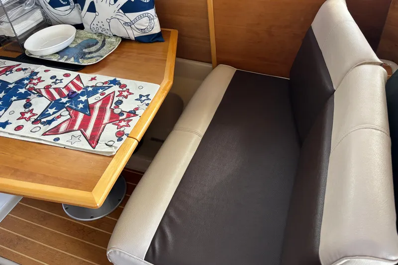 Slide: The Image of Interior of 2013 Cutwater C-28 boat with patriotic-themed table setting and cushioned seating. - 10