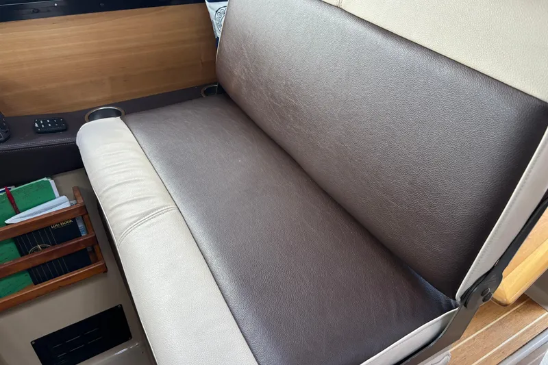 Slide: The Image of Brown and beige leather seating in 2013 Cutwater C-28 boat interior. - 13