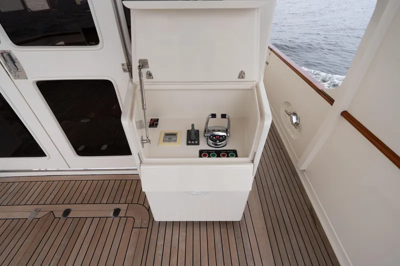 Slide: The Image of 2007 Fleming 55 yacht control panel on teak deck, near cabin door. - 31