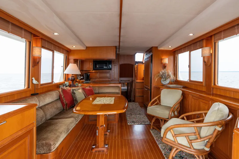 Slide: The Image of Luxurious interior of a 2007 Fleming 55 yacht with elegant wood finishes and comfortable seating. - 33