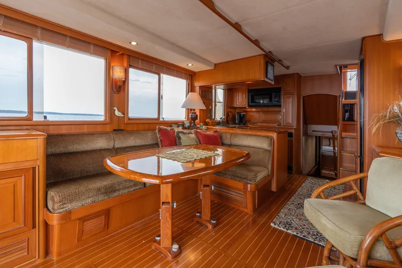 Slide: The Image of Luxurious 2007 Fleming 55 yacht interior with elegant wood finish and cozy seating area. - 34